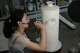 Chinese porcelain artist Chen Qing paints a vase in Jingdezhen, known as China's "Porcelain Capital," in eastern China's Jiangxi province, Tuesday, Sept. 1, 2026.