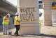 Workers with Pulice Construction paint over anti-ICE graffiti at the site where ICE agents shot Wilber Rafael Garces Perez at the intersection of Research Boulevard and Anderson Square in Austin on Monday, Sept. 21, 2026.