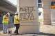 Workers with Pulice Construction paint over anti-ICE graffiti at the site where ICE agents shot Wilber Rafael Garces Perez at the intersection of Research Boulevard and Anderson Square in Austin on Monday, Sept. 21, 2026.