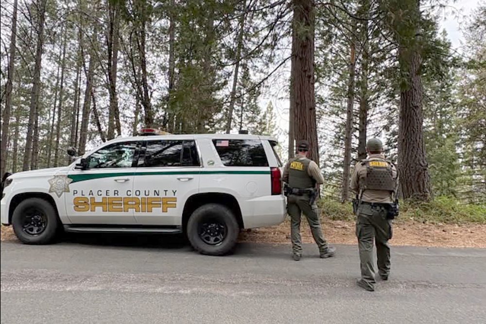 California suspect fleeing police breaks into home, kills woman