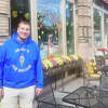 Jesse Pruchnik, owner of Jesse's Ice Cream on Main Street in New Milford, who has been ordered to remove neon-style LED lights from his display window. 