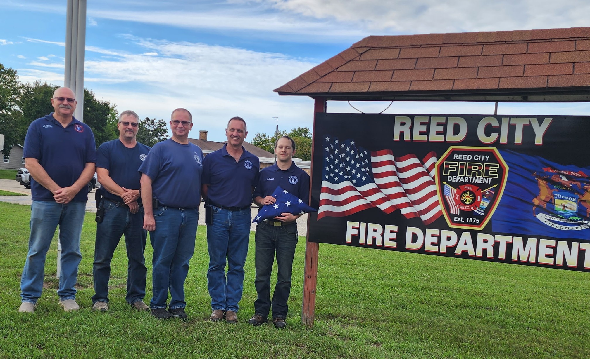 Mecosta Chapter DAR honors Reed City firefighters with Patriot Week flag presentation