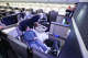Attendees pose for pictures in the Polaris business class seating of a United Airlines Boeing 787-9 during a media event at Los Angeles International Airport on March 24, 2026.