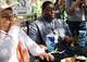 (From left) Dallas Morning News food reporter Imelda García and breaking news reporter Everton Bailey Jr. try Uncle Bubba's Pickle Dip available at Fernie's during opening day of the State Fair of Texas at Fair Park in Dallas, Friday, Sept. 25, 2026.