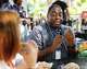 Dallas Morning News breaking news reporter Everton Bailey Jr. talks after trying Eataly’s Focaccia alla Porchetta e Salsa Verde during opening day of the State Fair of Texas at Fair Park in Dallas, Friday, Sept. 25, 2026.