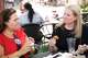 (From left) Dallas Morning News Energy & Natural Resources Reporter Lana Ferguson and Managing Editor Amy Hollyfield react after trying the Fried Ranch Bombs from Ranchero Deep Fried Love during opening day of the State Fair of Texas at Fair Park in Dallas, Friday, Sept. 25, 2026.