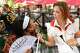 (From left) Dallas Morning News food digital producer Zacharia Washington tries Fernie’s Frozen Espresso-tini Bar as restaurant critic Sarah Blaskovich holds it during opening day of the State Fair of Texas at Fair Park in Dallas, Friday, Sept. 25, 2026.
