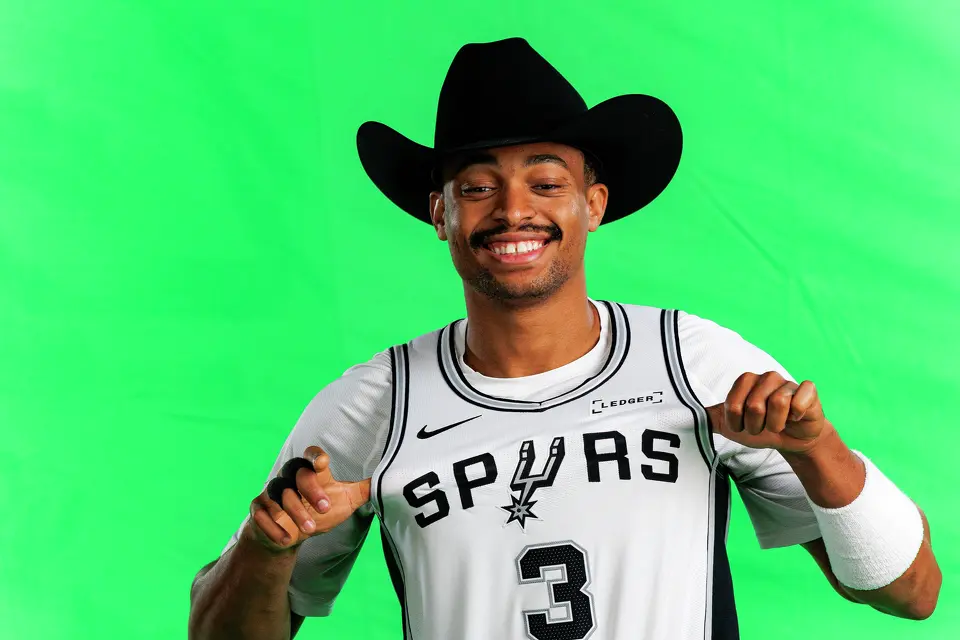 San Antonio Spurs forward Keldon Johnson (3) poses for photos and video clips during the NBA team’s media day at the Victory Capital Performance Center in San Antonio, Monday, Sept. 28, 2026.