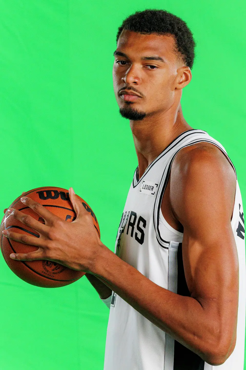 San Antonio Spurs’ Victor Wembanyama (1) poses for photos and video clips during the NBA team’s media day at the Victory Capital Performance Center in San Antonio, Monday, Sept. 28, 2026.