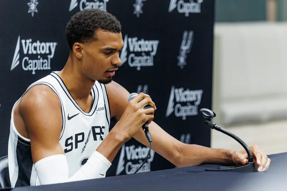 San Antonio Spurs’ Victor Wembanyama answers questions from reporters during the NBA basketball team’s media day at the Victory Capital Performance Center in San Antonio, Monday, Sept. 28, 2026.