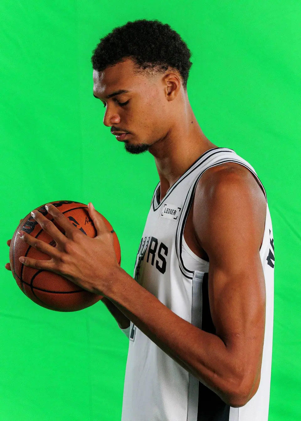 San Antonio Spurs’ Victor Wembanyama (1) poses for photos and video clips during the NBA team’s media day at the Victory Capital Performance Center in San Antonio, Monday, Sept. 28, 2026.