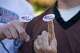 Young voters show the "I Voted" stickers after voting at a polling station in Plano, Texas, the United States, Nov. 3, 2020. Texans have until Oct. 5 to register to vote in the Nov. 3, 2026, midterm elections.