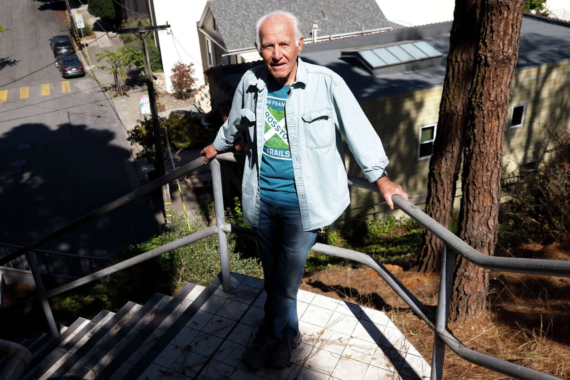 Bob Siegel, shown at the Burnside mural and steps, developed the 17-mile Crosstown Trail after retiring from City College of San Francisco 20 years ago.