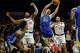 Golden State Warriors guard Brandin Podziemski (2) grabs a rebound during the first half of a preseason NBA basketball game against Los Angeles Clippers, Sunday, Oct. 4, 2026, in Honolulu. (AP Photo/Mengshin Lin)