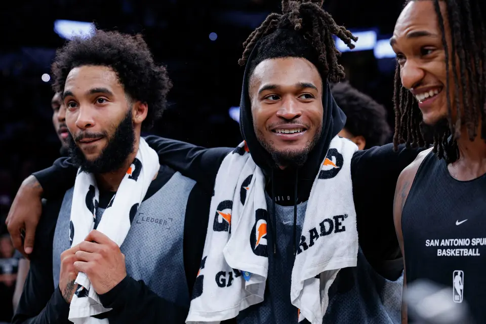 San Antonio Spurs players Julian Champagnie, from left, Stephon Castle and Devin Vassell watch the rookies sing karaoke for the crowd following the Silver & Black Scrimmage at Frost Bank Center in San Antonio, Sunday, Oct. 4, 2026.