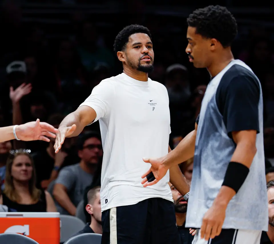 San Antonio Spurs’ Tobias Harris slaps hands with his teammate Keldon Johnson during a Silver & Black Scrimmage timeout at Frost Bank Center in San Antonio, Sunday, Oct. 4, 2026.