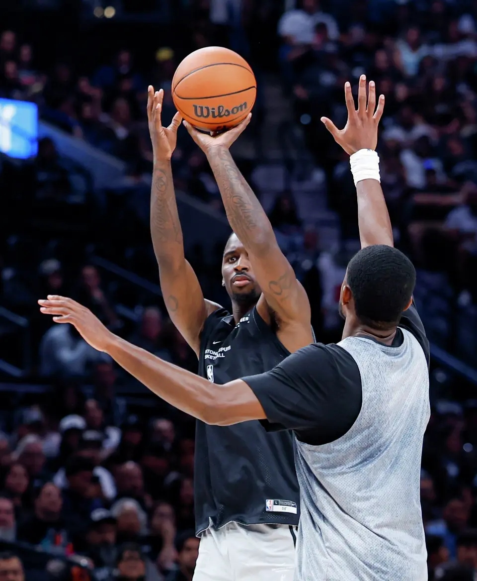 Spurs’ David Jones Garcia takes a shot over De’Aaron Fox during the Silver & Black Scrimmage at Frost Bank Center in San Antonio, Sunday, Oct. 4, 2026.