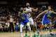 Warriors forwards Draymond Green (23) and Yaxel Lendeborg position themselves for a potential rebound during a preseason game Sunday against the Los Angeles Clippers in Honolulu.