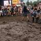 Festival attendees navigate around mud at the Austin City Limits Music Festival in Zilker Park on Saturday, Oct. 3, 2026.