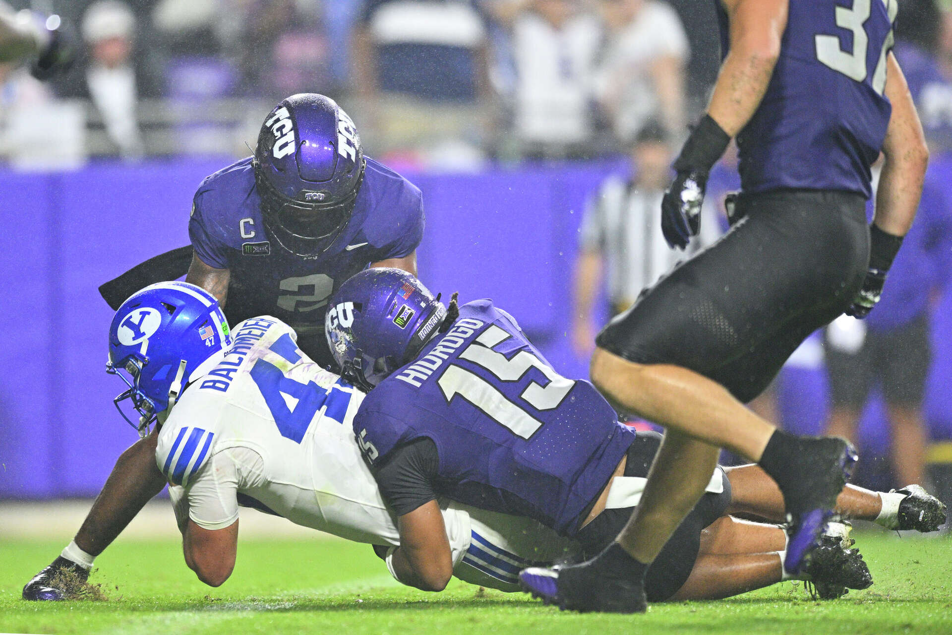 FORT WORTH, TX - OCTOBER 03: BYU Cougars quarterback Bear Bachmeier (47) dives for a touchdown as he is tackled by TCU Horned Frogs safety Devyn Hidrogo (15) du