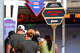 FILE: Visitors cue beneath the Lightning Lane sign at Space Mountain in Tomorrowland at Disneyland in Anaheim, Calif.