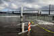 A king tide approaches the Embarcadero shore near Pier 14 in San Francisco in January. More high tides in the coming days will probably send water sloshing over the Embarcadero again, a preview of the extremely high tides expected over the winter.