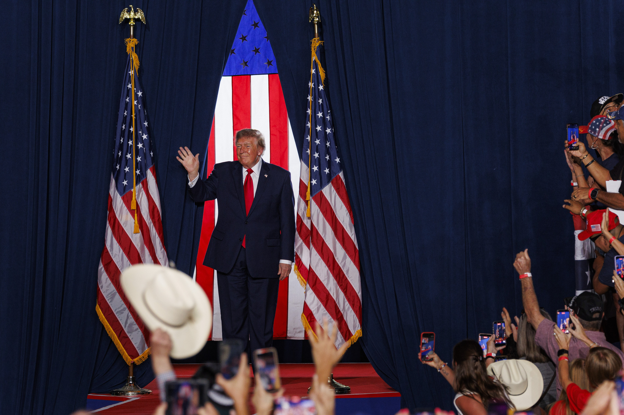 President Donald Trump returned to San Antonio to rally support for Republican candidates Ken Paxton and Carlos De La Cruz, drawing supporters and protesters. See photos from the event.