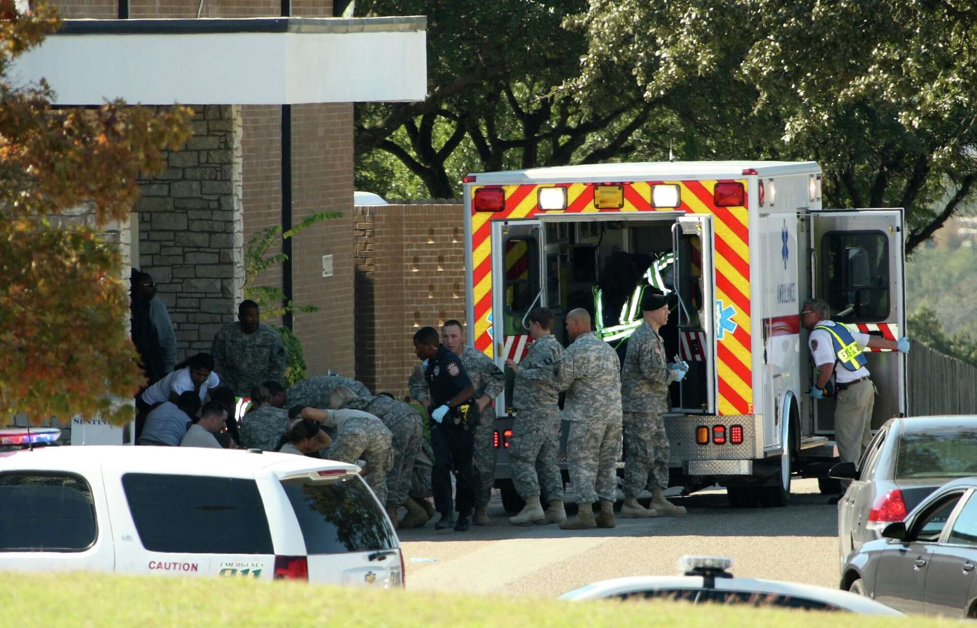 Wounded soldiers at Fort Hood are evacuated from the scene of a mass shooting on Nov. 5, 2009. Then-Army Maj. Nidal Hasan opened fire on soldiers preparing to d