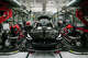 Robotic arms install the front seats of the Tesla Model 3 at the Tesla factory in Fremont, Calif., on Thursday, July 26, 2018.