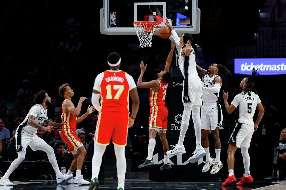 San Antonio Spurs forward/center Victor Wembanyama (1) blocks a shot from Atlanta Hawks guard Aaron Wiggins (2) during the second quarter of the preseason opener at Frost Bank Center in San Antonio, Thursday, Oct. 8, 2026.