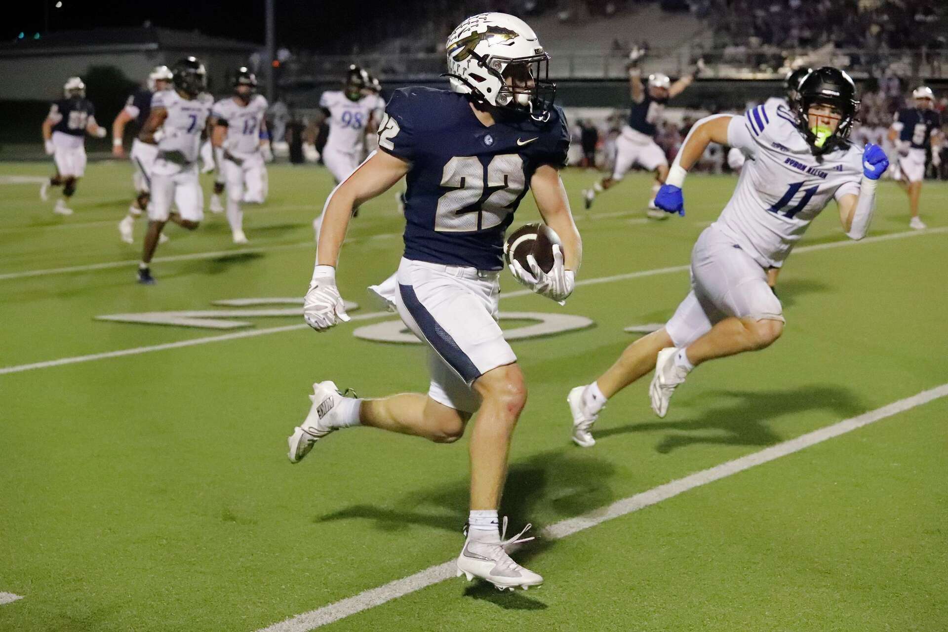 Keller High School running back Blake Dyniewski (22) scores the go ahead touchdown late in the game as Keller High School hosted Byron Nelson High School in a d