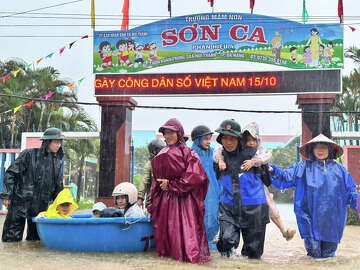 Vietnam mobilizes troops after heavy rains trigger flash floods and ...