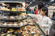 Nearly 2,000 customers swarmed the market making its West Coast debut in Cupertino.