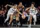The Valkyries earn their spot in the WNBA Finals with an OT victory over the Aces and then face the Dream 2 Gabby Williams (1) and Veronica Burton (22) of the Golden State Valkyries defend against A'ja Wilson (22) of the Las Vegas Aces during the first half of Game 3 of the WNBA basketball semifinals, Friday, Oct. 9, 2026, in Las Vegas. (Carlos Avila Gonzalez/San Francisco Chronicle via AP)/San Francisco Chronicle via AP)