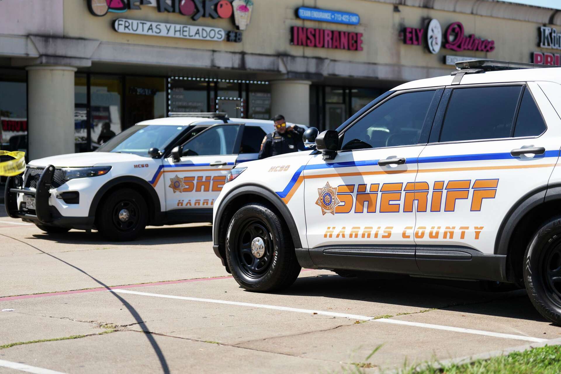 Harris County Sheriff deputies work the scene after a man was struck by an ICE agent’s vehicle during an immigration enforcement in northwest Houston, Saturday,