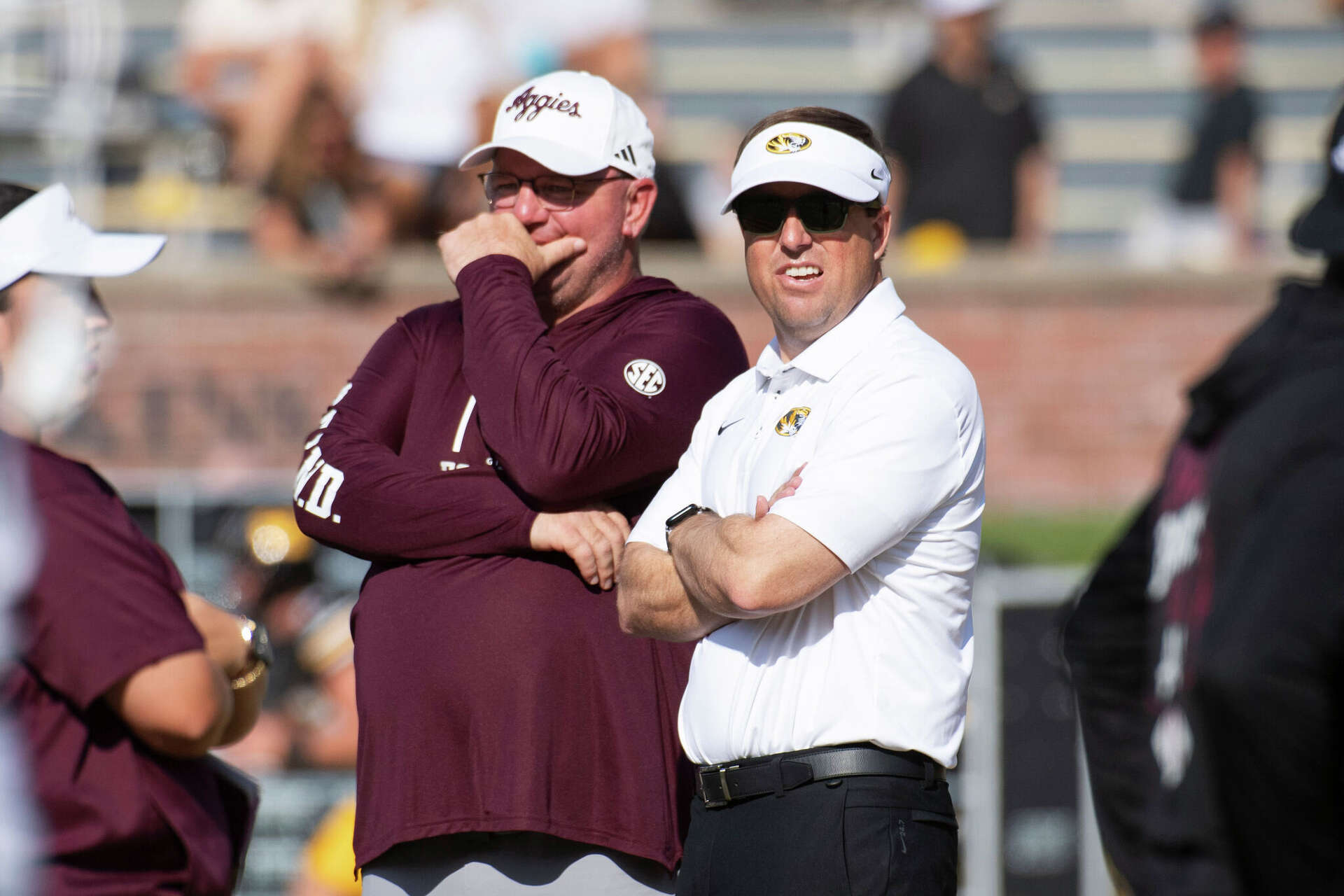 Missouri head coach Eli Drinkwitz, right talks with Texas A&M head coach Mike Elko before an NCAA college football game Saturday, Oct. 10, 2026, in Columbia, Mo