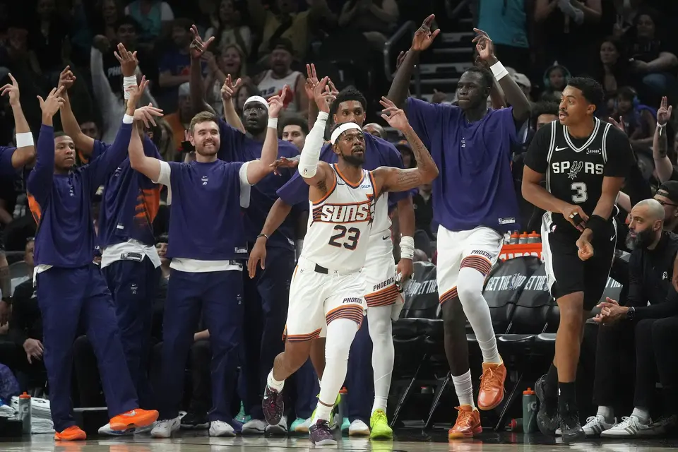 Phoenix Suns guard Jordan Goodwin (23) celebrates a 3-pointer against the San Antonio Spurs during a preseason NBA basketball game, Saturday, Oct. 10, 2026, in Phoenix. (AP Photo/Ross D. Franklin)