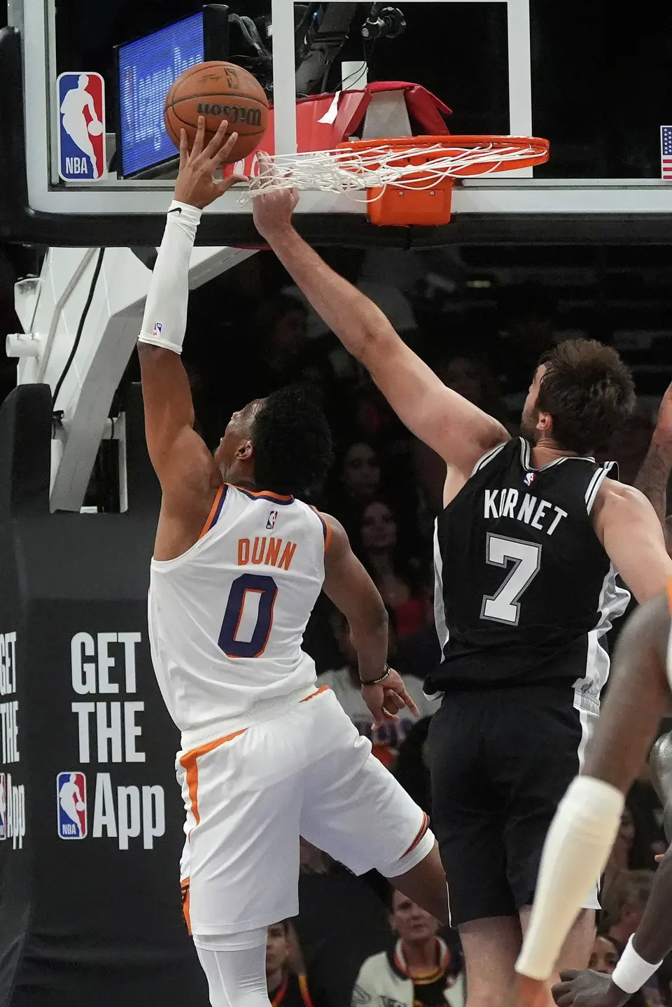 San Antonio Spurs center Luke Kornet (7) blocks a shot by Phoenix Suns forward Ryan Dunn (0) during a preseason NBA basketball game, Saturday, Oct. 10, 2026, in Phoenix. (AP Photo/Ross D. Franklin)