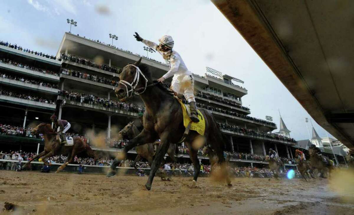 Skip Dickstein: I think my most interesting picture this year is of Calvin Borel standing in the irons on Super Saver, holding his three fingers aloft after winning the Kentucky Derby, which was his third win in the most prestigious race in the thoroughbred industry. The photograph was made with a remote camera under the rail of the track and was partially obscured by mud splatters from the horse going past the finish line the first time. This shows the dramatic image framed by some of the track splatter from rain earlier on Derby Day in Louisville, Ky.