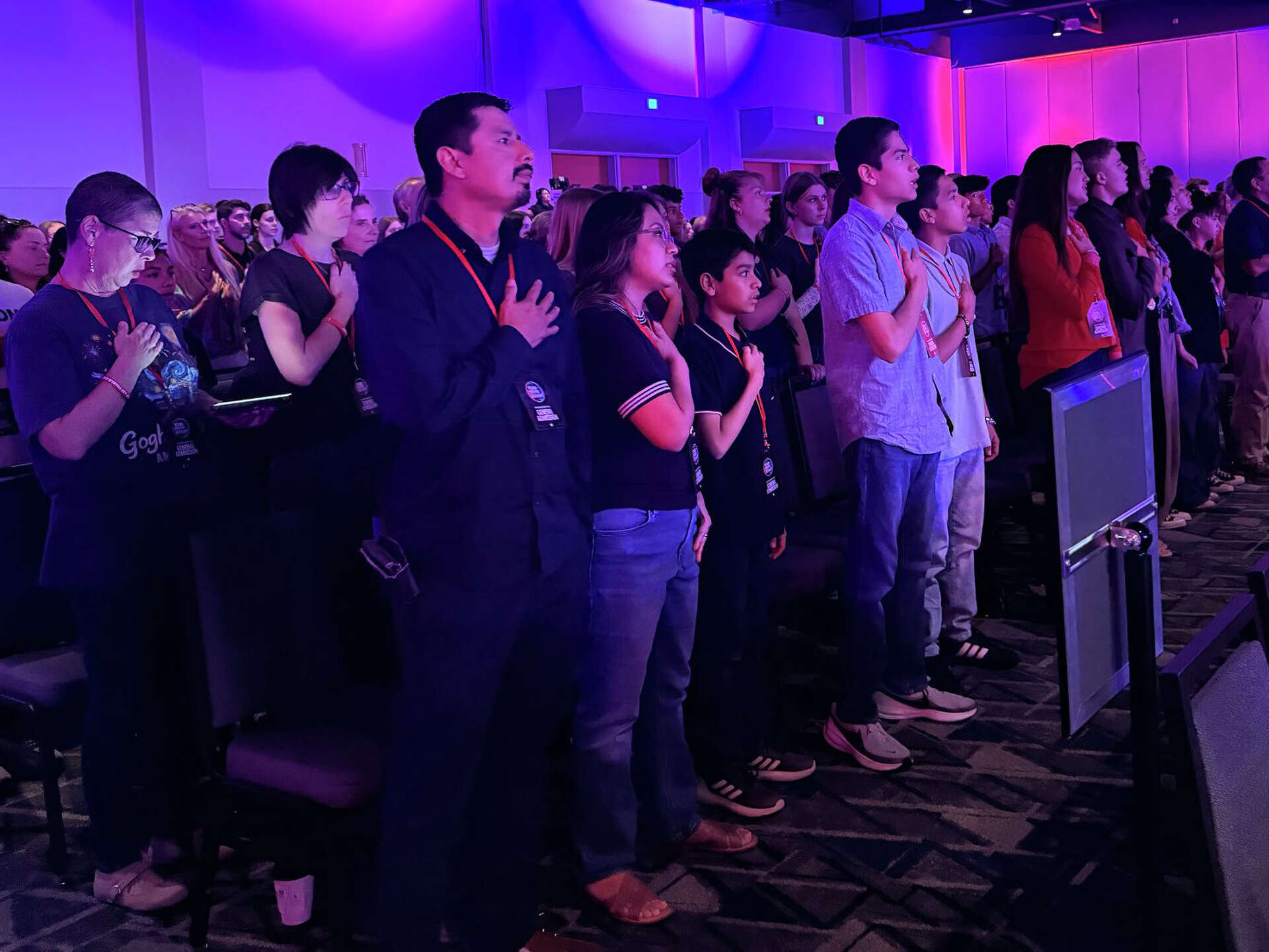 Young people stand for the Pledge of Allegiance during the Texas Youth Summit in The Woodlands, Friday, Oct. 9, 2026.