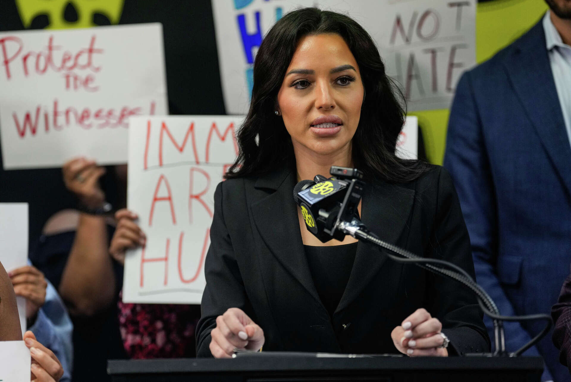 Attorney Kim Bruno speaks during a news conference about an Immigration and Customs Enforcement action that left Miguel Parra Hernandez with a broken leg, in Ho