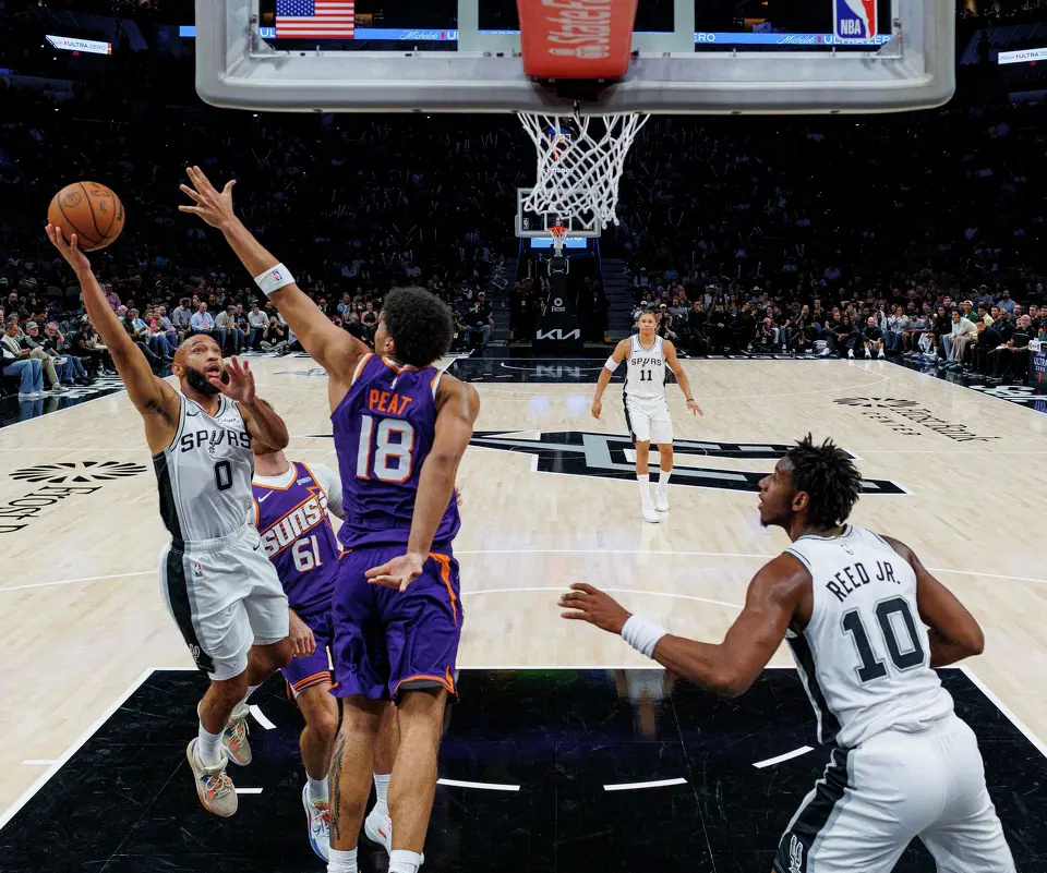 San Antonio Spurs guard Jordan McLaughlin (0) goes up for a shot during the second half of a preseason NBA game against the Phoenix Suns at Frost Bank Center in San Antonio, Wednesday, Oct. 14, 2026. The Spurs defeated the Suns 123-103.