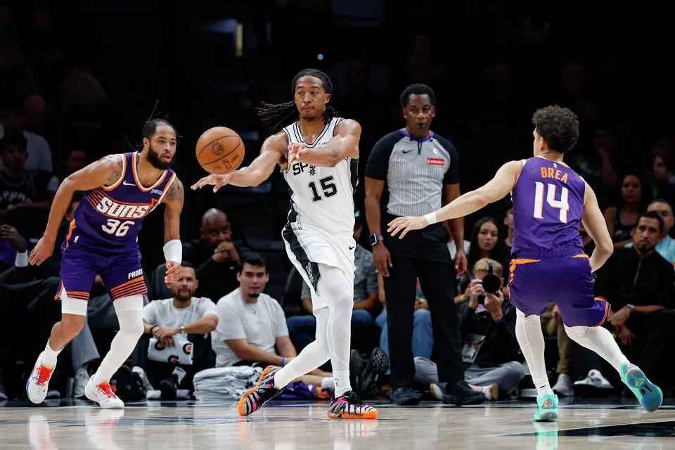 San Antonio Spurs forward Maliq Brown (15) makes a pass during the fourth quarter of a preseason NBA game against the Phoenix Suns at Frost Bank Center in San Antonio, Wednesday, Oct. 14, 2026. The Spurs defeated the Suns 123-103.