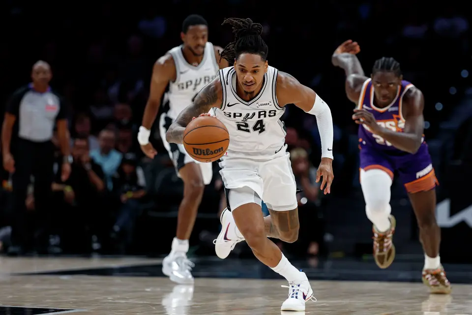 San Antonio Spurs guard Devin Vassell (24) races down the court after forcing a Phoenix Suns turnover during the first half of a preseason NBA game at Frost Bank Center in San Antonio, Wednesday, Oct. 14, 2026.
