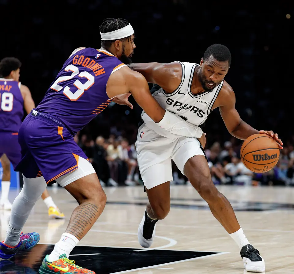 Phoenix Suns guard Jordan Goodwin (23) guards San Antonio Spurs forward Harrison Barnes (40) during the first half of a preseason NBA game at Frost Bank Center in San Antonio, Wednesday, Oct. 14, 2026.