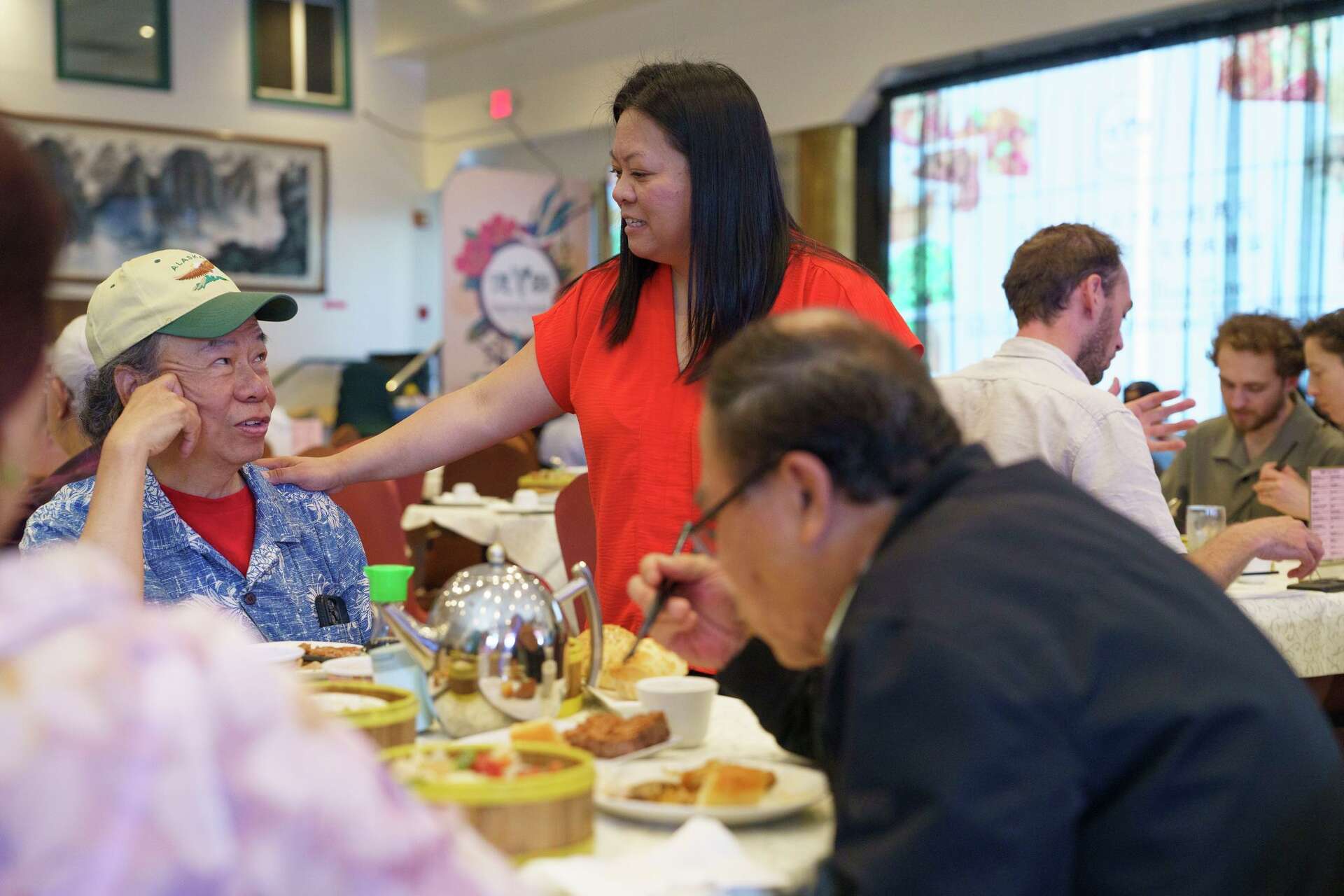 Elaine Chan greets Paul Ly at Imperial Garden Restaurant in San Francisco on Saturday, Oct. 3, 2026. The two are longtime friends. Chan grew up helping out her 