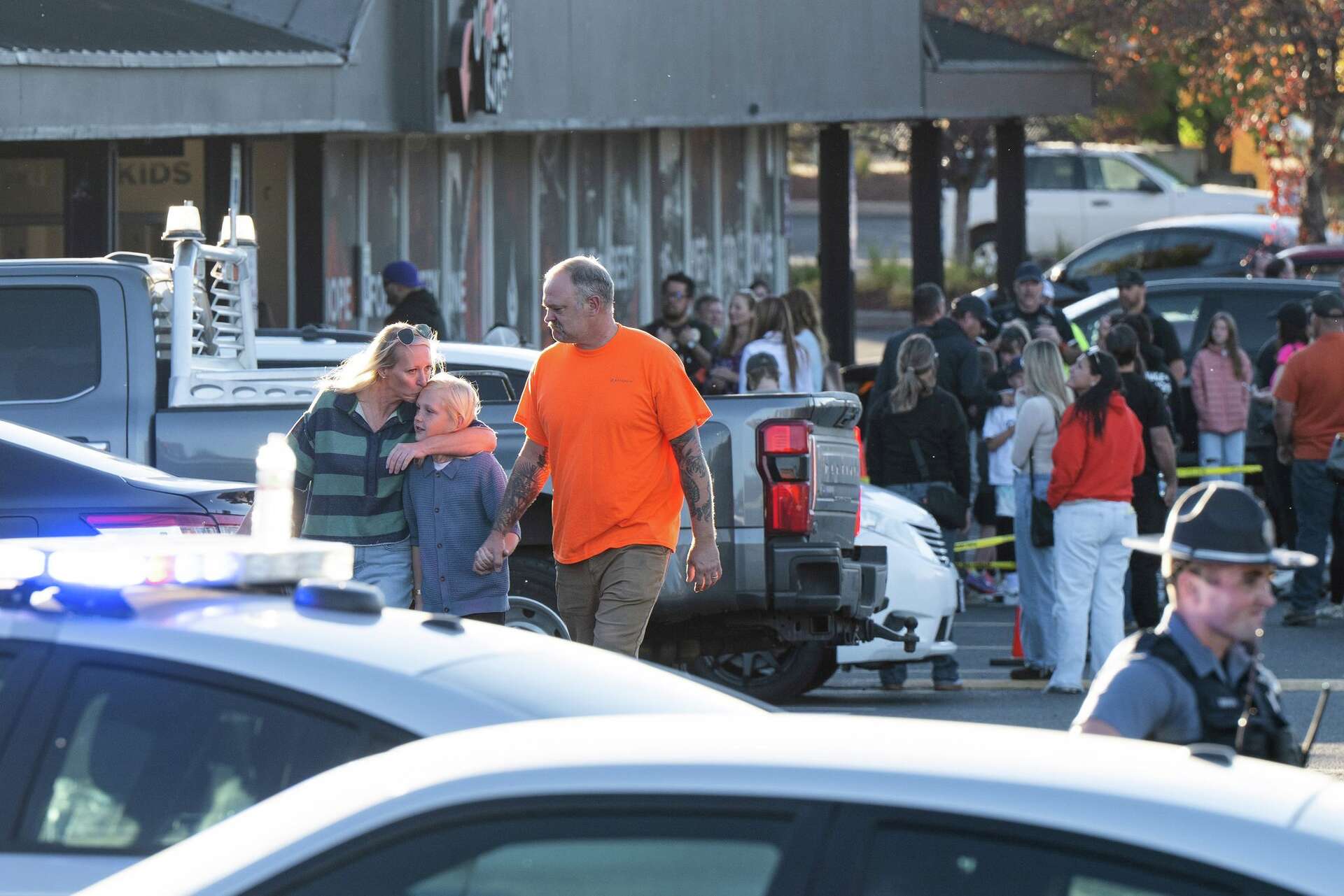 People leave a family meeting area following a shooting at Silver Rail Elementary School, Thursday, Oct. 15, 2026, in Bend, Ore.