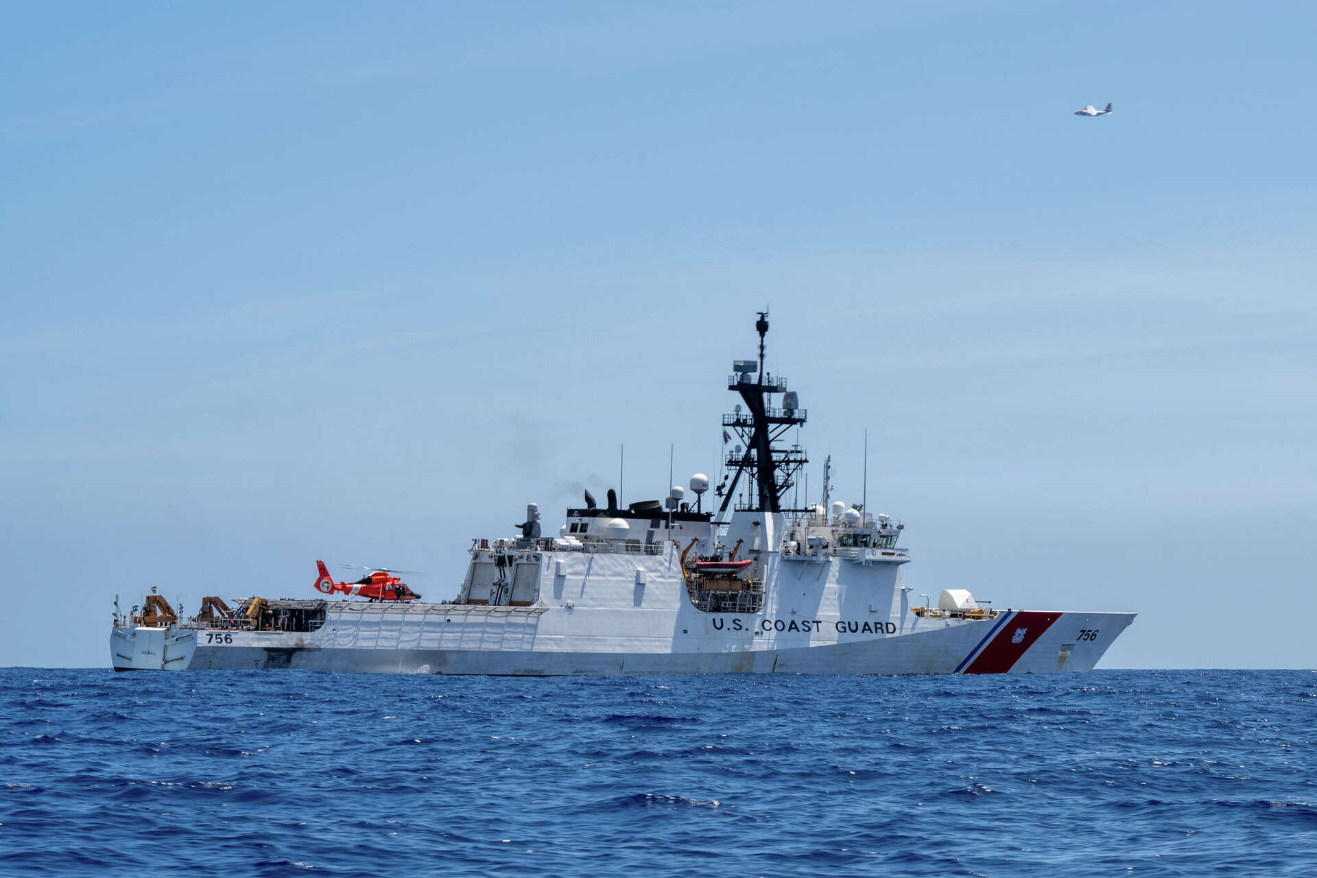 FILE: An MH-65 Dolphin helicopter assigned to Coast Guard Air Station Barbers Point lands on the flight deck of the Legend-class cutter USCGC Kimball (WMSL 756)