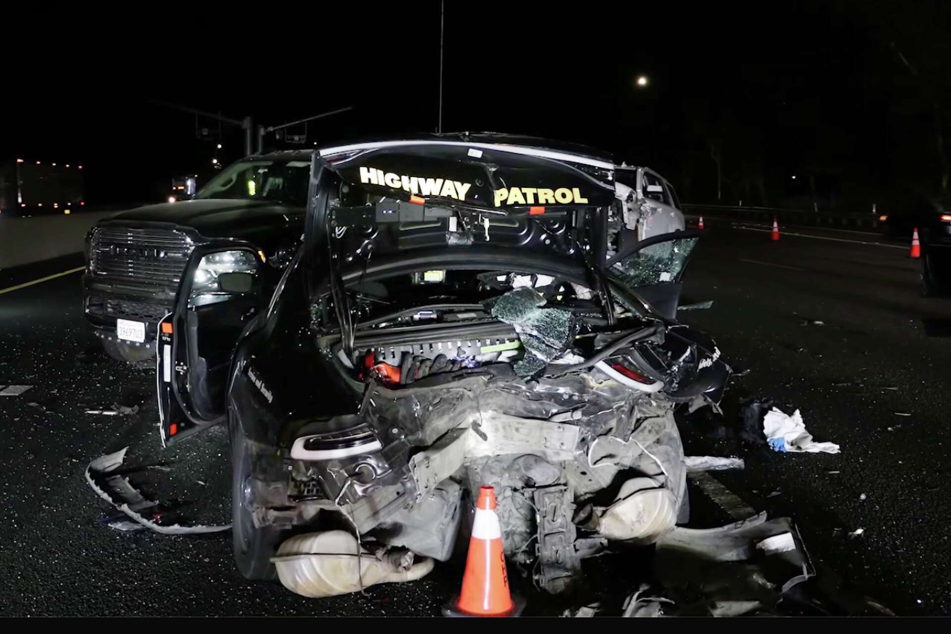 A Tesla traveling on eastbound I-80 in Solano County struck a CHP patrol vehicle investigating a fatal crash, seriously injured two officers, on Oct. 13, 2026.