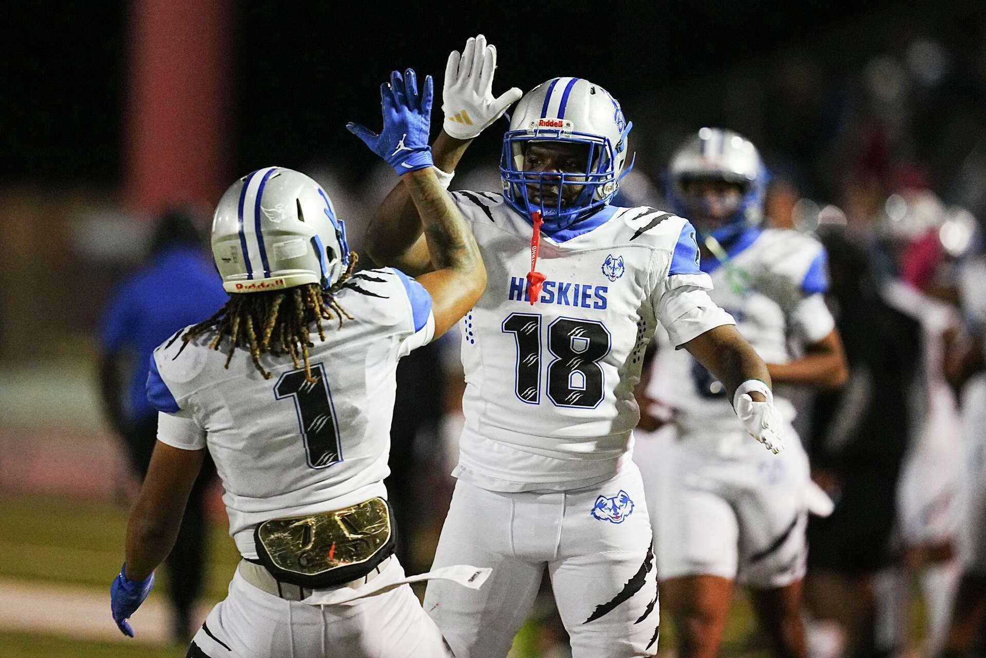 Westbury’s Machi Harden, right, celebrates with Josiah McCants after running for a touchdown during a high school football game at Butler Stadium, Friday, Oct.